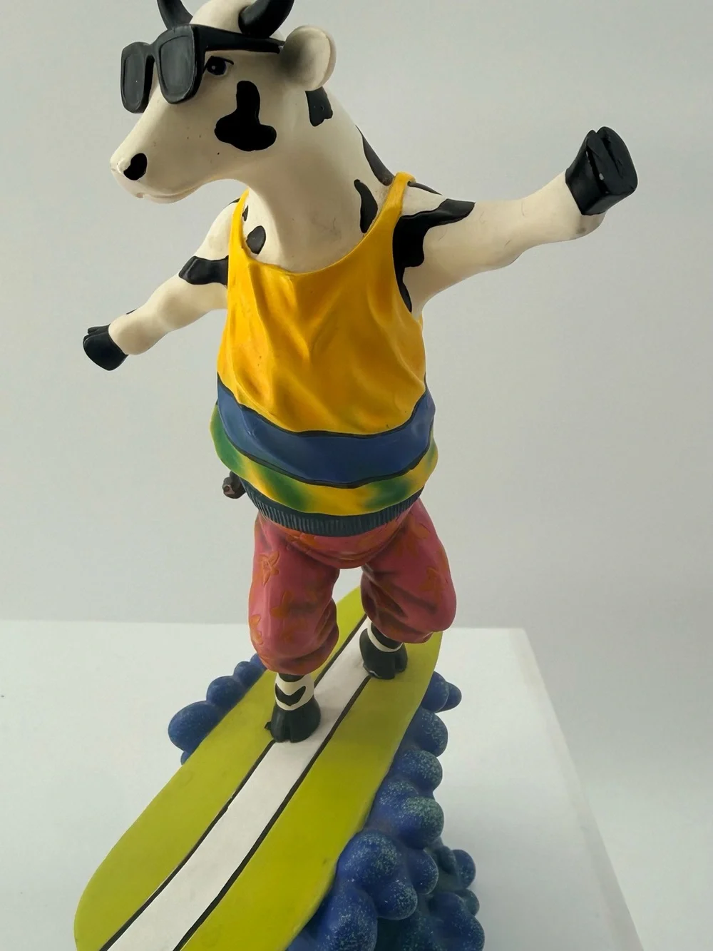 Playful Yellow Cow Figurine with Sunglasses Decorative Accent